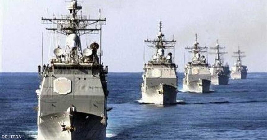 Line of gray military ships sailing in formation across the ocean (Reuters photo). - برفيلكس - brieflex