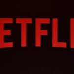 Netflix logo in red on a black background. - برفيلكس - brieflex