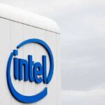 Intel logo displayed on the side of a white building against a cloudy sky - برفيلكس - brieflex